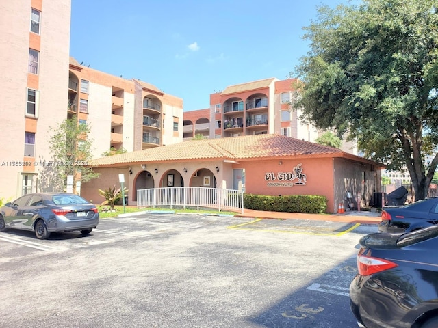 view of property featuring uncovered parking