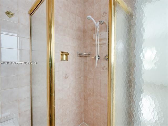 bathroom with a shower stall