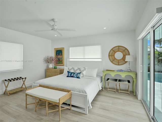 bedroom with access to exterior, baseboards, wood finished floors, and recessed lighting