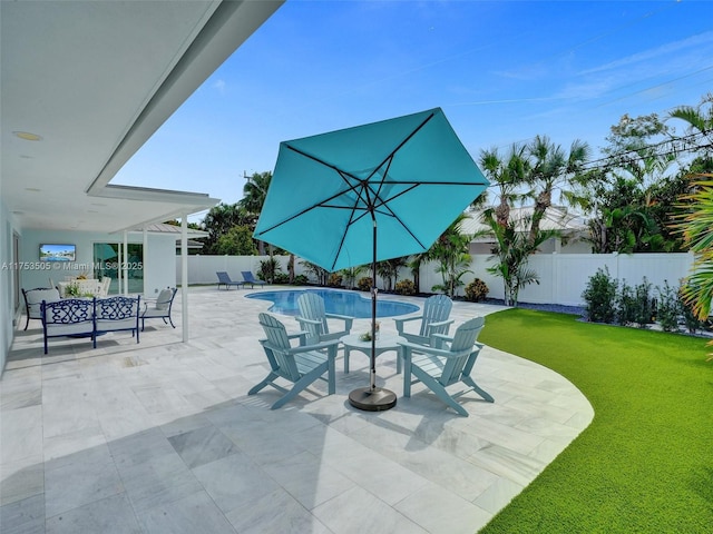 view of patio featuring a fenced backyard and a fenced in pool