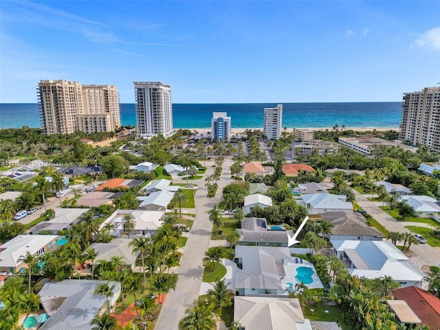 drone / aerial view with a view of city and a water view