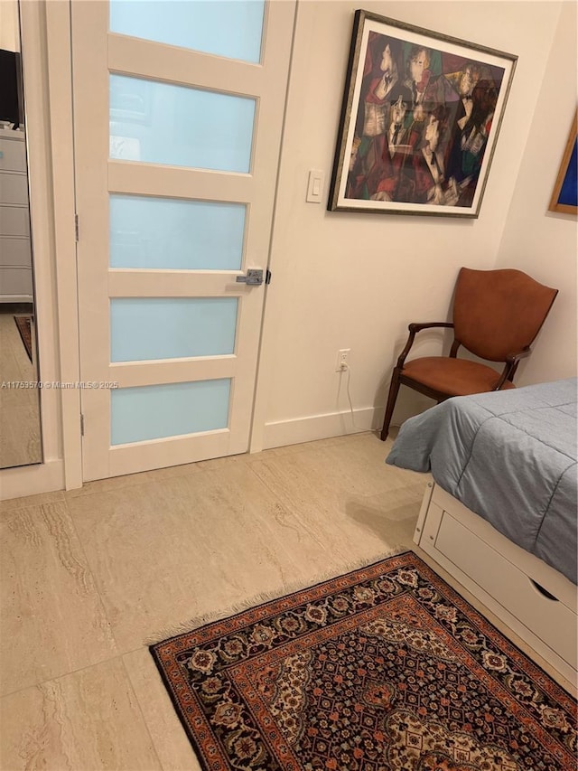 bedroom featuring baseboards