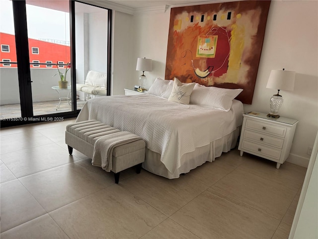 tiled bedroom featuring baseboards, ornamental molding, and access to outside