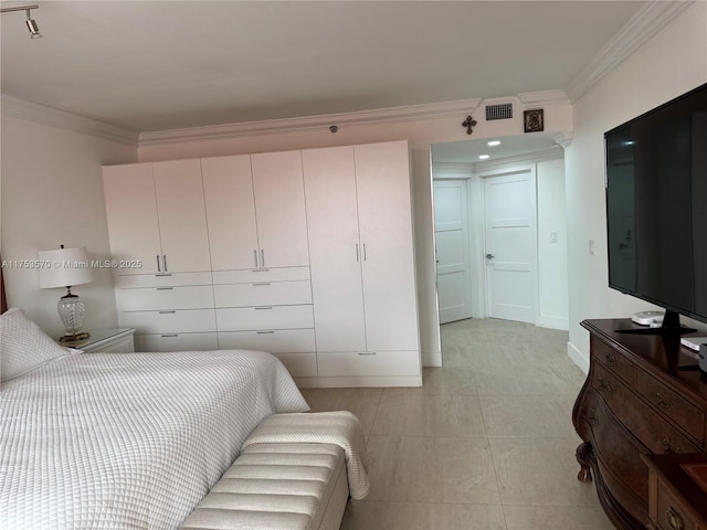 bedroom featuring visible vents and ornamental molding