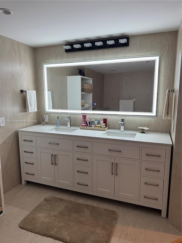 bathroom featuring double vanity and a sink