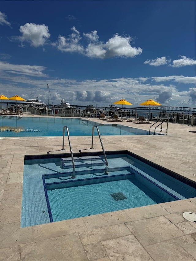 community pool featuring a patio area