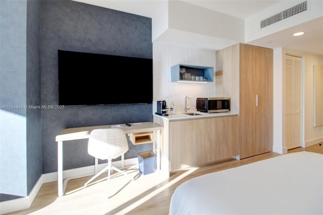 601 NE 1st Ave Unit 1706, Miami, FL 33132 - bedroom featuring baseboards, visible vents, light wood-style floors, a sink, and recessed lighting