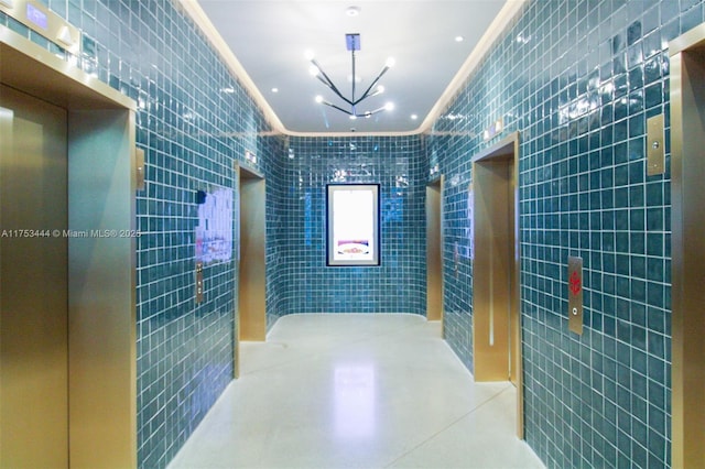 601 NE 1st Ave Unit 1706, Miami, FL 33132 - corridor with tile walls and crown molding