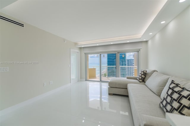 tiled living area featuring visible vents, baseboards, and recessed lighting