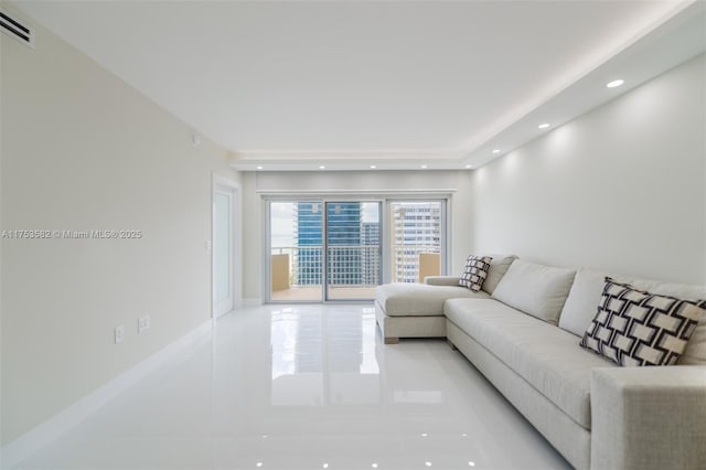 living area with recessed lighting and visible vents