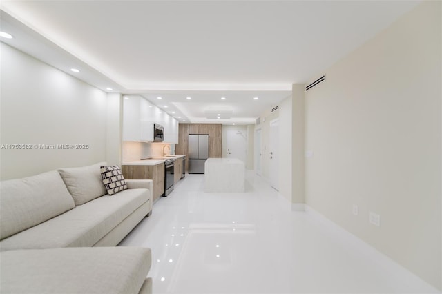 living room with visible vents and recessed lighting