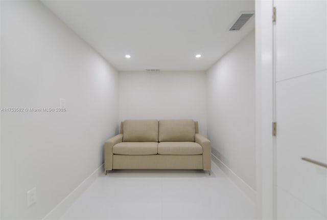 sitting room featuring baseboards, visible vents, and recessed lighting