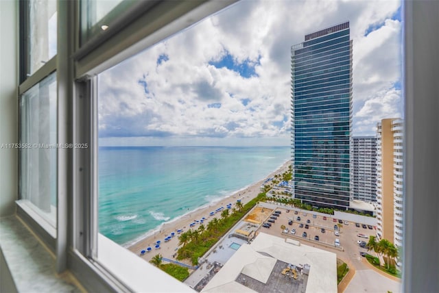 view of water feature featuring a view of city and a beach view