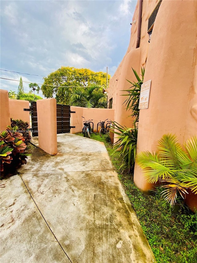 200 Azure Way, Miami Springs, FL 33166 - view of patio with a gate and fence