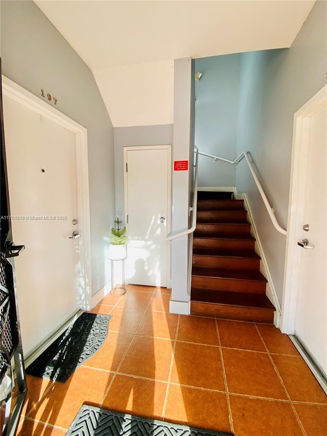 200 Azure Way, Miami Springs, FL 33166 - stairway with vaulted ceiling, baseboards, and tile patterned floors