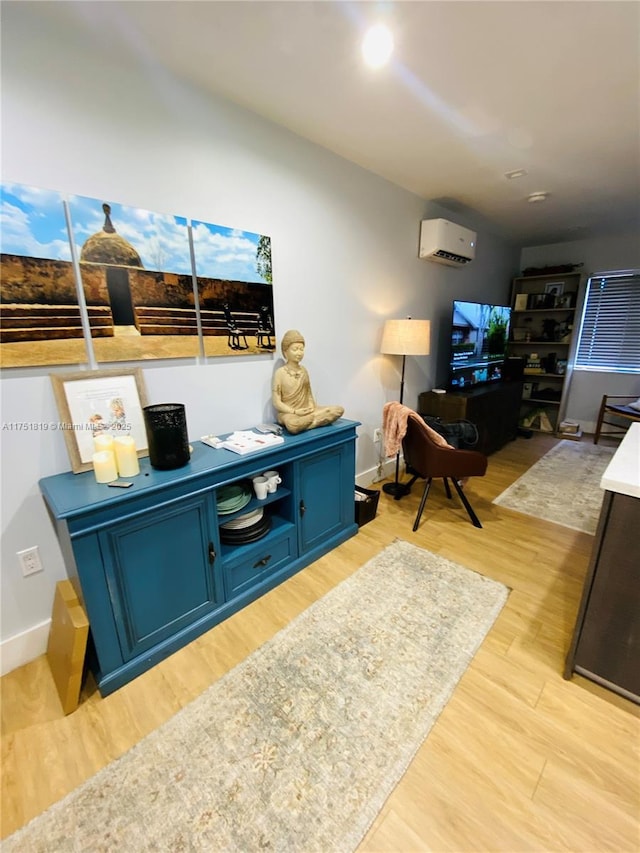 200 Azure Way, Miami Springs, FL 33166 - living area featuring an AC wall unit, light wood finished floors, and baseboards