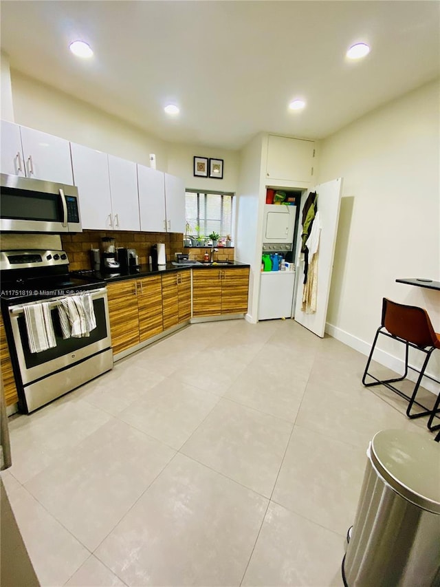 200 Azure Way, Miami Springs, FL 33166 - kitchen with dark countertops, recessed lighting, decorative backsplash, appliances with stainless steel finishes, and a sink