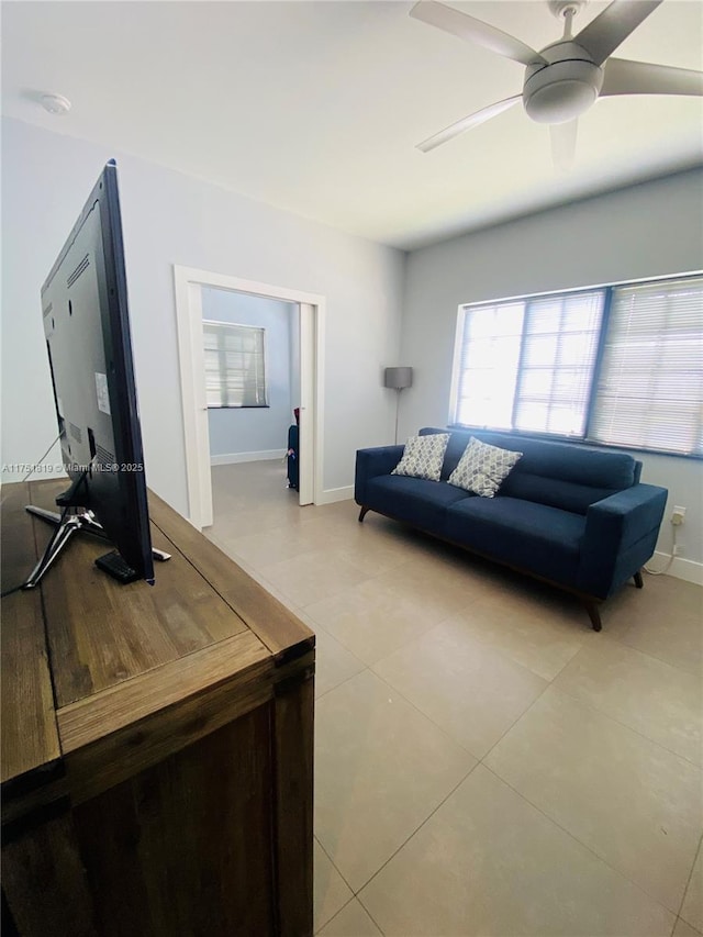 200 Azure Way, Miami Springs, FL 33166 - living room with light tile patterned floors, a ceiling fan, and baseboards
