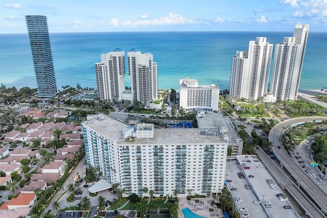 drone / aerial view with a view of city and a water view