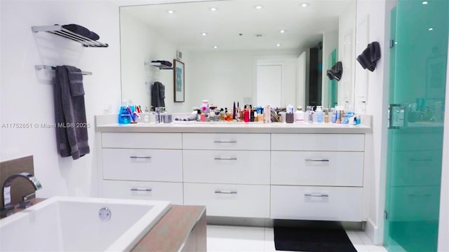 full bathroom featuring a garden tub, a sink, a shower stall, and double vanity