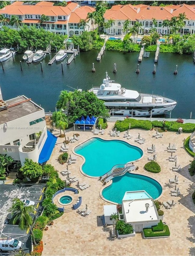 bird's eye view featuring a water view and a residential view