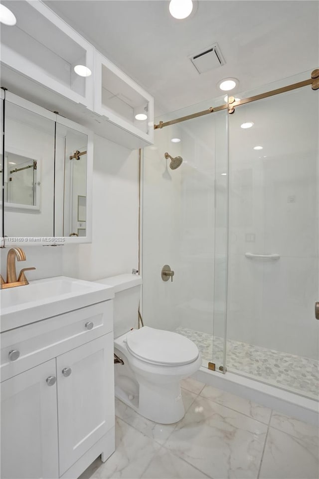 full bathroom with marble finish floor, visible vents, toilet, a shower stall, and vanity