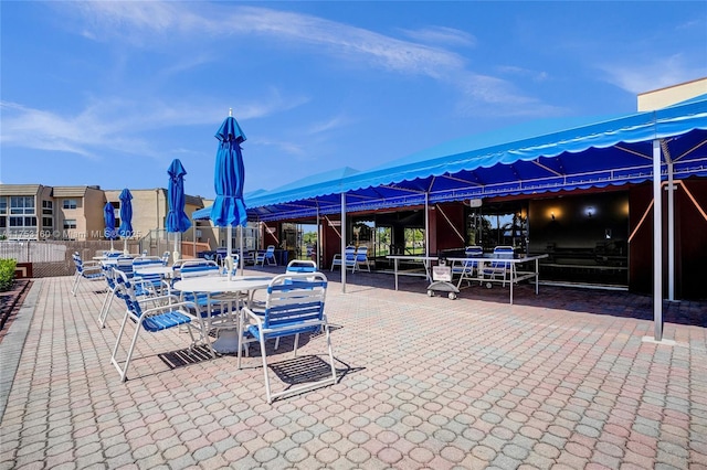 view of patio / terrace with outdoor dining space and fence