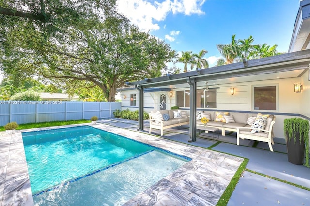 view of pool with a patio area, a fenced backyard, an outdoor living space, and a fenced in pool