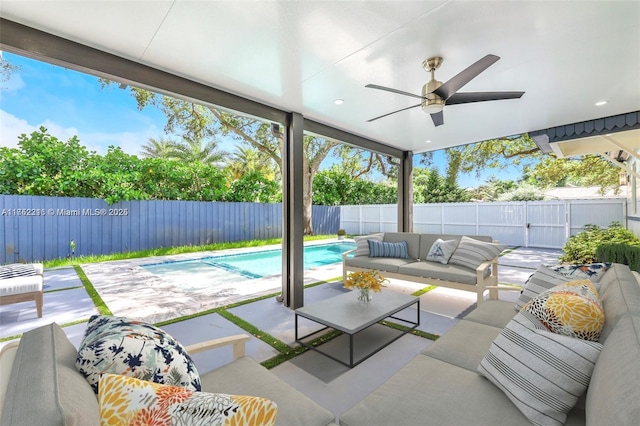 view of patio with a ceiling fan, a fenced in pool, a fenced backyard, and an outdoor hangout area