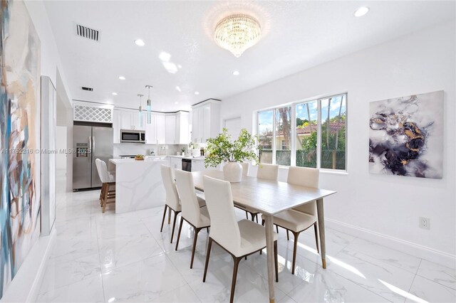 dining room featuring a chandelier, recessed lighting, visible vents, baseboards, and marble finish floor