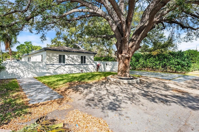 view of front of home featuring fence