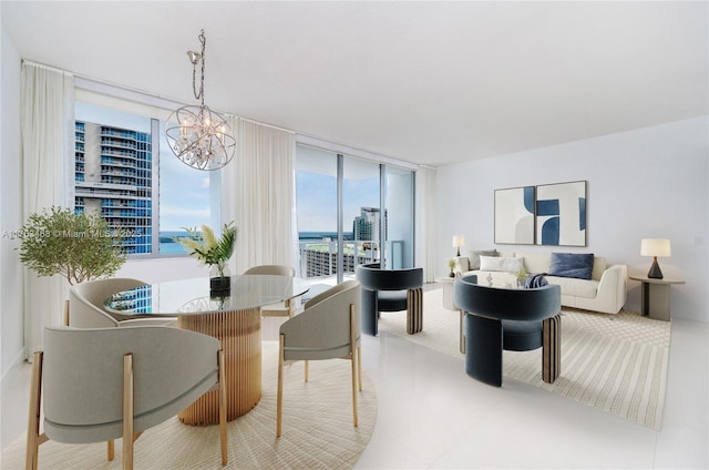 dining space with a chandelier and a wall of windows