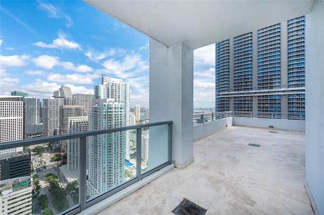 balcony with a view of city and visible vents