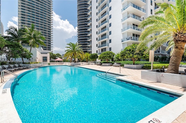 community pool featuring a patio area