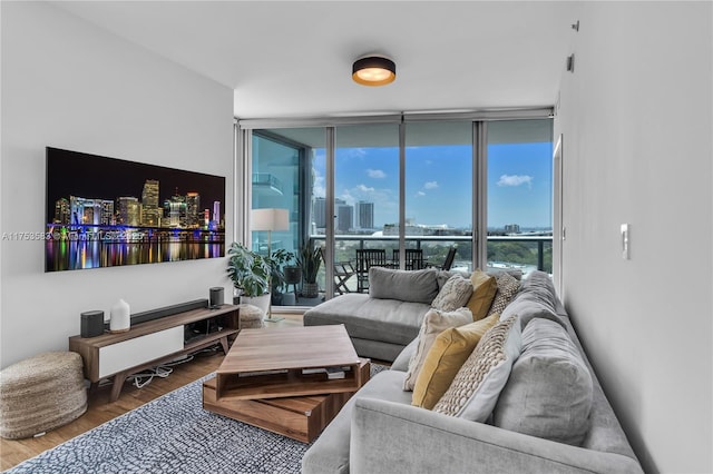 living area featuring a wall of windows and wood finished floors