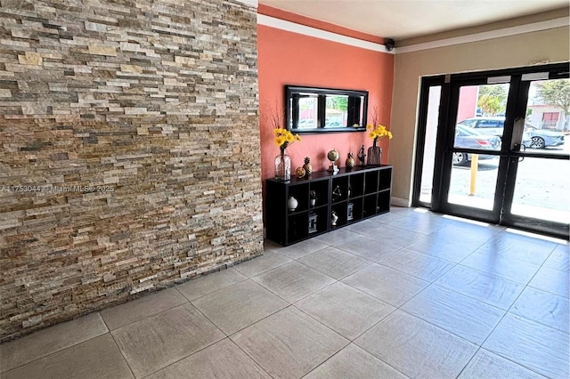 interior space with tile patterned flooring and french doors