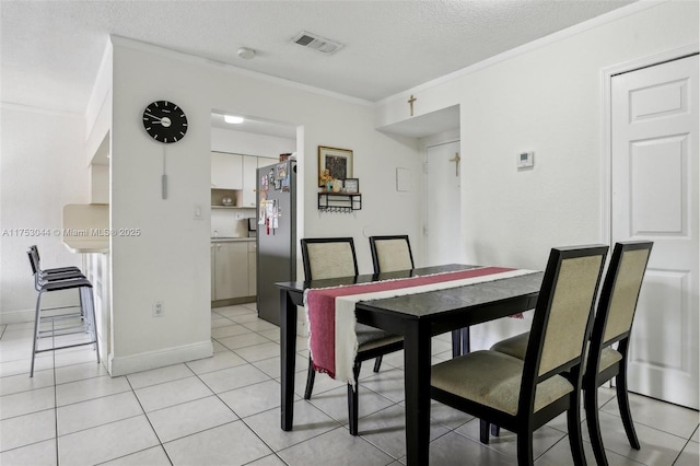 8425 NW 8th St Unit 404, Miami, FL 33126 - dining space with ornamental molding, a textured ceiling, and light tile patterned floors