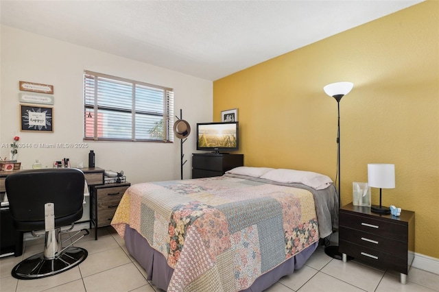 bedroom featuring light tile patterned flooring