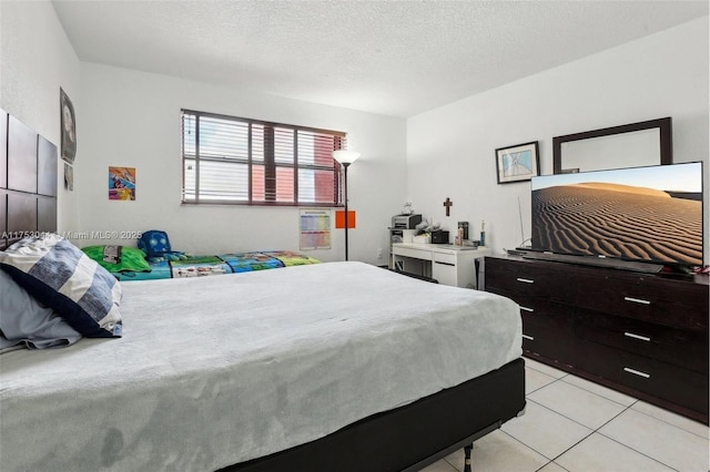8425 NW 8th St Unit 404, Miami, FL 33126 - bedroom featuring light tile patterned flooring, a closet, and baseboards