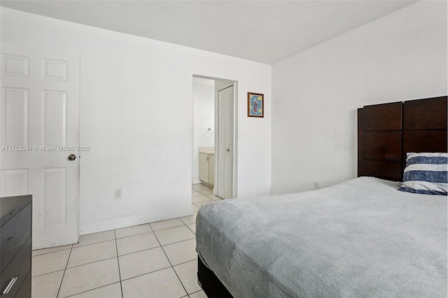 8425 NW 8th St Unit 404, Miami, FL 33126 - bedroom with light tile patterned floors and baseboards