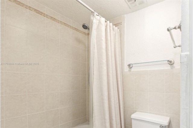 8425 NW 8th St Unit 404, Miami, FL 33126 - bedroom featuring light tile patterned floors, a textured ceiling, and baseboards