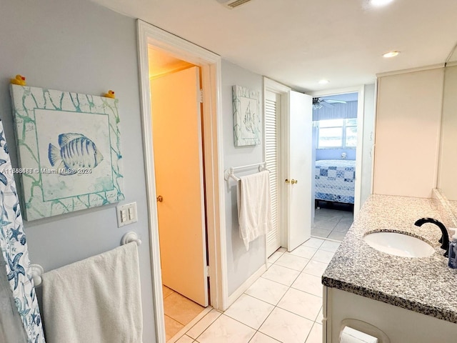 ensuite bathroom with ensuite bathroom, tile patterned flooring, recessed lighting, vanity, and a ceiling fan