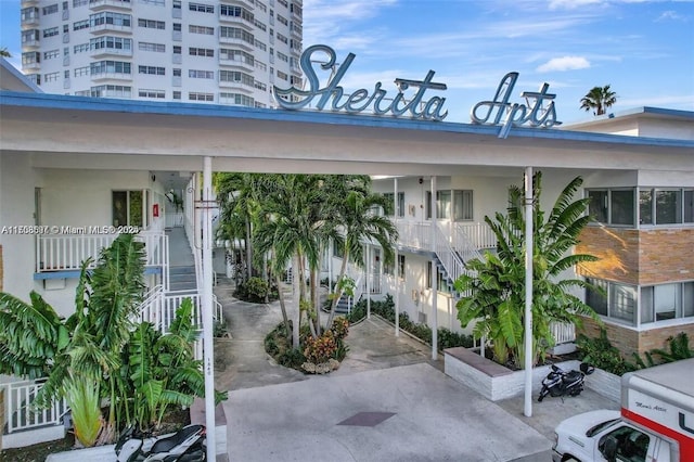 view of property featuring stairway