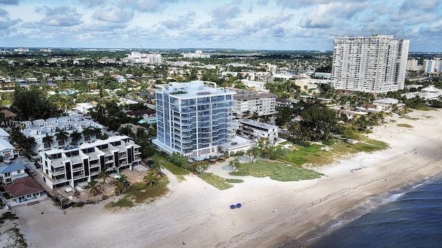 drone / aerial view with a view of the beach and a view of city