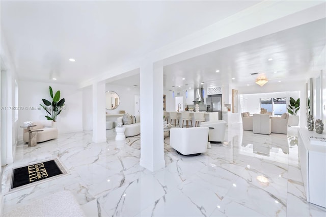 living room with marble finish floor and recessed lighting