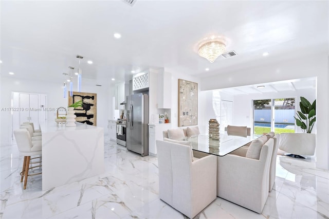 dining area featuring marble finish floor, visible vents, and recessed lighting