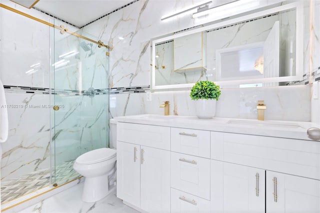 bathroom with toilet, marble finish floor, a sink, and a marble finish shower