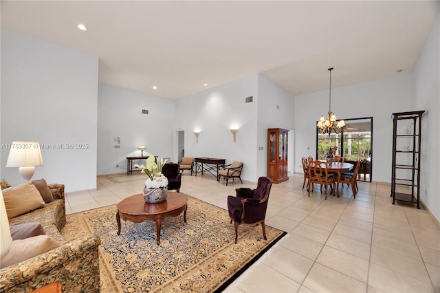 living area featuring light tile patterned floors, visible vents, a chandelier, and recessed lighting