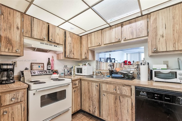 kitchen featuring light countertops, white appliances, a sink, and under cabinet range hood