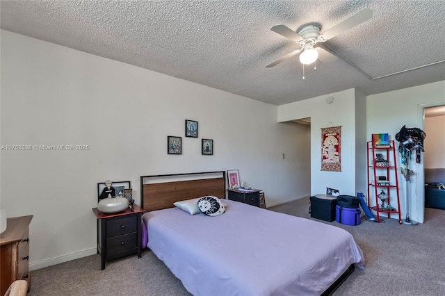 carpeted bedroom featuring a ceiling fan, a textured ceiling, and baseboards